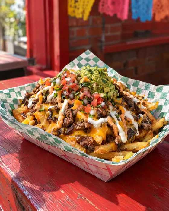 La Papas: loaded fries with carne asada, cheddar, guacamole and pico de gallo.