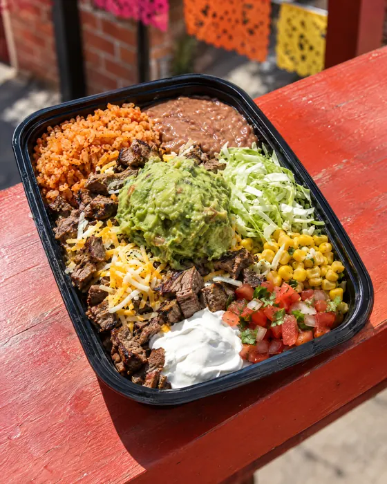 Mexi-Sexi Bowl with rice, beans, carne asada and guacamole.