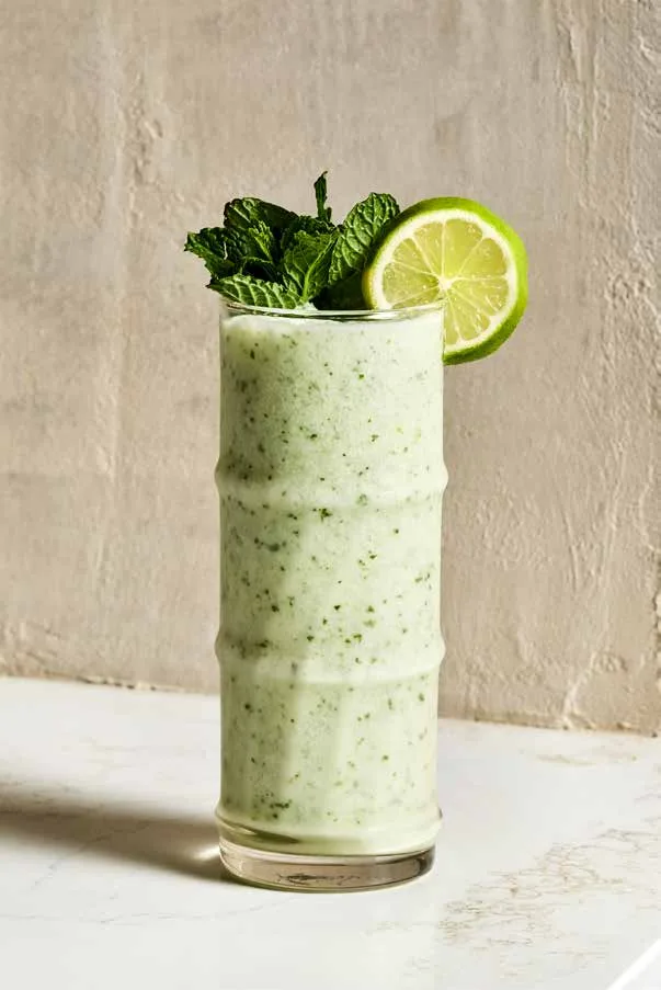 Carefuleta, a frozen pale green mint drink with a lime wheel and mint sprig